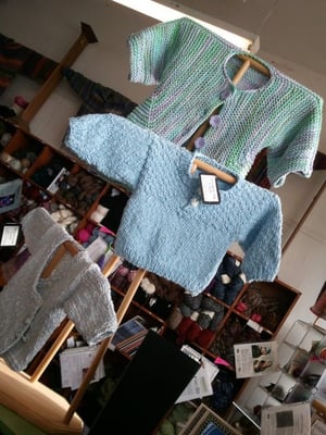 A few of the pattern sample sweaters on display... each has a tag listing what pattern and yarn was used.