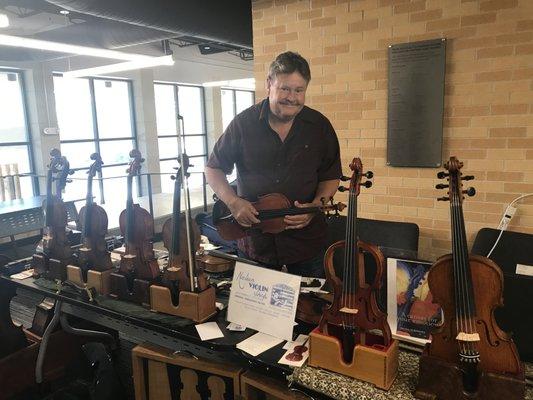 Nielsen Violin Shop on site during Omaha Conservatory of Music Soundwaves and Summer Suzuki Institute.