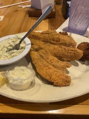 2 piece fish dinner with slaw, potato salad, hush puppies and white beans. Fantastic!