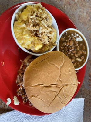 Brisket sandwich, baked beans and cheesy tater tots