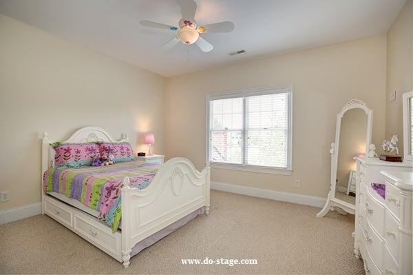 'After' of occupied staging of bedroom by DO-STAGE! LLC
 
 The bedroom walls were hot pink and loaded with furniture/accessories before!