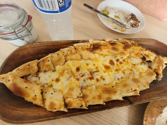 Beef pide.  Delicious!!!!!!! Feed one person with another one getting a couple of pieces "to taste"