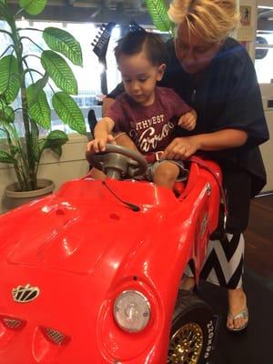 Daniella strapping him into his seatbelt in the other car he wanted to ride in after his cut!