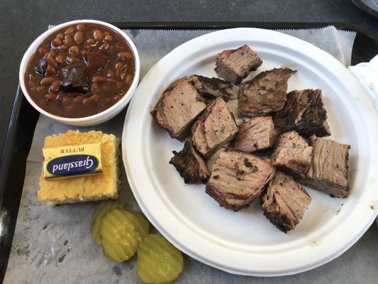 Burnt ends plate with bbq beans and corn bread