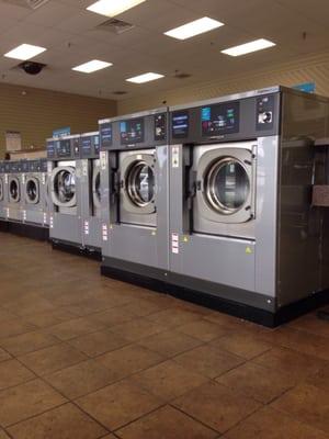 Giant washers. You could fit a month of laundry from three people in these things. Or a Cali king comforter