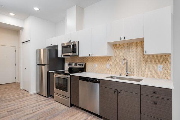 Kitchen with modern backsplash and stainless steel appliances