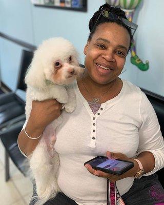 A client with her freshly groomed dog.