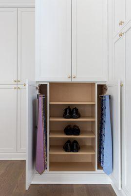 We added this double tie rack and shelving to this large open space to add storage using minimal space.