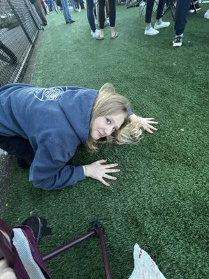 The turf is GREEN, when I step on the turf it crunches between my toes my behind is comfortable when it's seated on the GREEN turf.