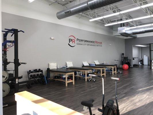 The Performance Rehab Olathe clinic offers an open concept treatment space complete with turf and top of the line equipment.