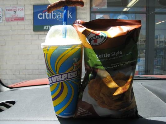 Medium Lemon Slurpee, Mustache Straw and 7-11-branded chips. #Slurpee #Brainfreeze