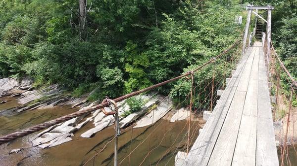 Swinging suspension bridge over the S. Toe River.