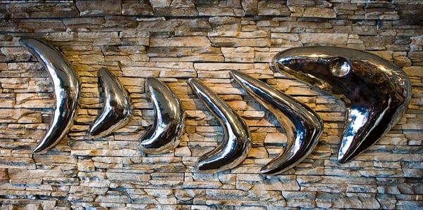 "Fish Bones" Cast Aluminum logo representation for Cajun's Wharf restaurant in Little Rock, AR on display at the dining wall.