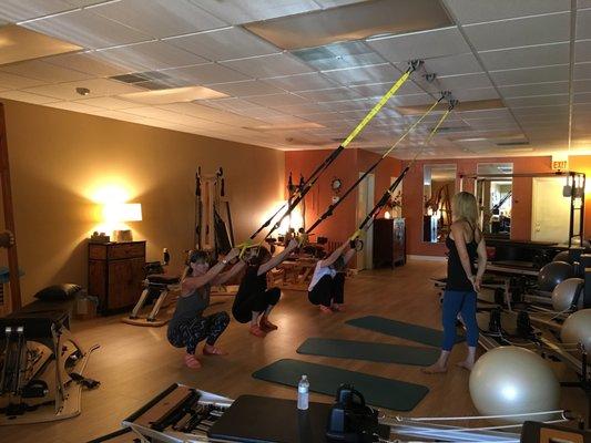 An example of Cinde giving us a taste of TRX during her small group Pilates class.. I'm telling you, she's a body whisperer!