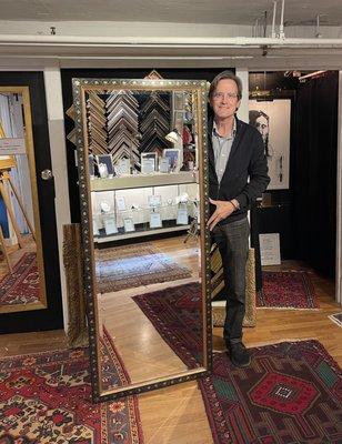 Dave presenting a full length mirror with a 23k gold leaf scraffito frame.