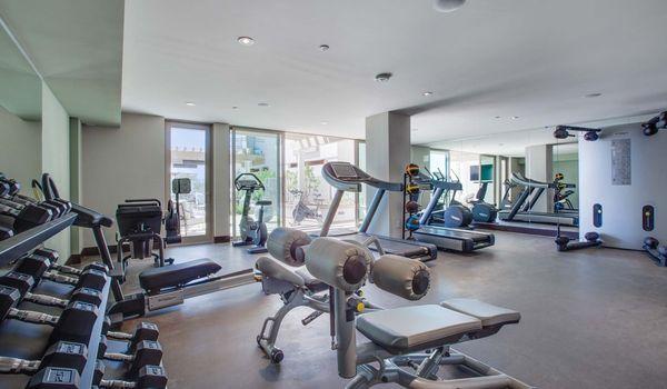 Workout at our state-of-the-art fitness center with TechnoGym equipment and an outdoor workout area