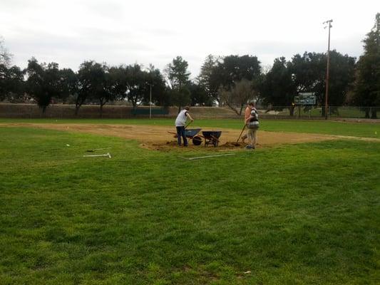 Getting the field ready for opening day in 2013