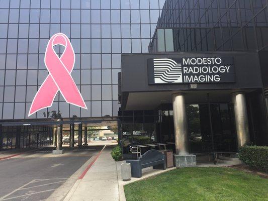 October is breast cancer awareness month.  Beautiful pink ribbon on the black building.