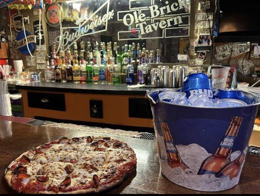 Sunday Funday pizza and a bucket of six domestic cans.  $20