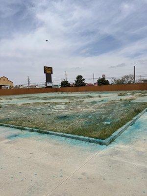 Stickers and Weed Spray, Future Dog Park at Hotel in Odessa Tx.