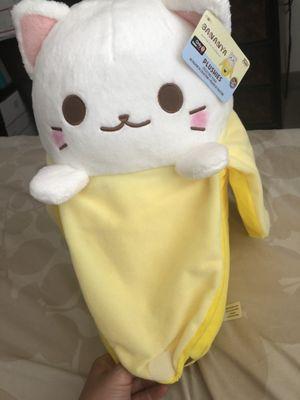 A cat in a banana plushie!