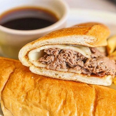 French dip fresh, sliced Boars Head roast beef, sharp provolone cheese on the long roll. Serve with Au jus sauce and french fries.