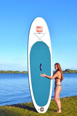 Michelle posing with one of her Red Paddle Co 10'8 RIDE boards she uses in her Paddle-Fit Classes & Group Tours