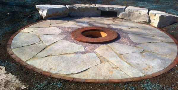 Limestone Outcropping Seat Wall, Flagstone Patio with a Clay and Fire Brick Fire Pit, with Decorative Stone Inlay.  West of Appleton