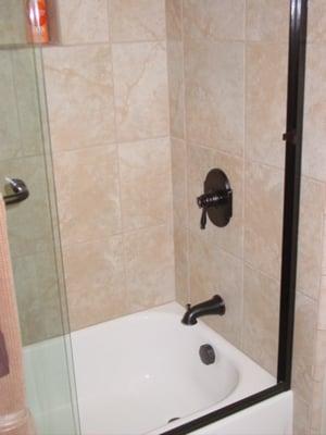 standard tub/shower special with new tub, tile walls and shower doors