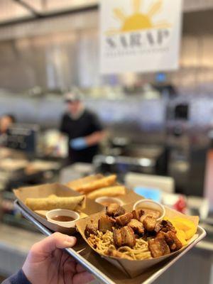 Foreground - Pancit with Lechon Kawali (deep fried pork belly). Back - beef lumpia and (limited time) apple pie lumpia