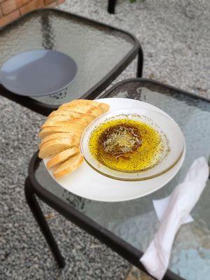 Italian bread and EVOO with herbs and cheese. Addicting!