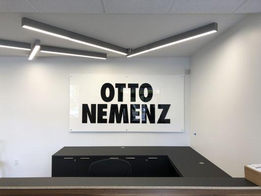 Custom dimensional lettering on an acrylic panel. The panel stands off the wall for extra dimension. A very unique look.