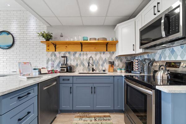 This kitchen features custom cabinets, Cambria quartz countertops, and Emser backsplash! Custom cabinets are the best way to fully customize