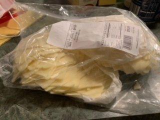 Deli cheese sloppily cut and 2 lbs shoved into one bag.