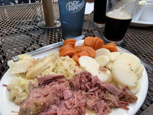 Corned Beef and Cabbage with carrots and sliced potatoes