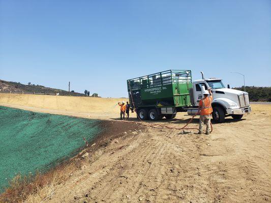 Hydroseeding a steep slope right off of the 15 freeway in San Diego County