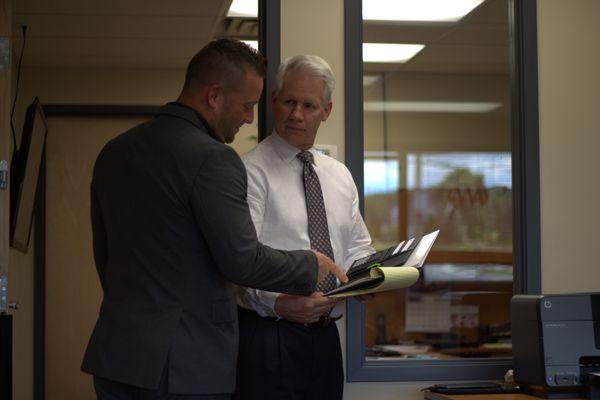 Glenn and Ben discussing a policy.