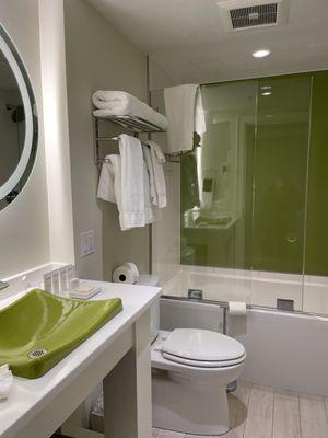 Lovely bathroom area with heated floor and automatic ventilation fan