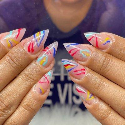 Acrylic nails with designs.