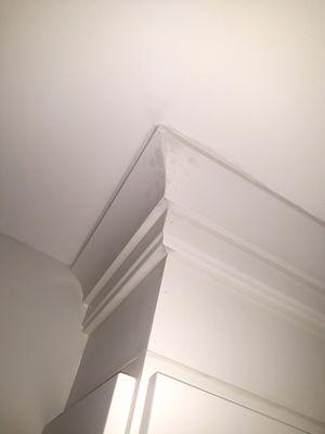 Ruined Crown Moldings from mishandling, and doctoring them with white primer. Contactor said nobody will see it.