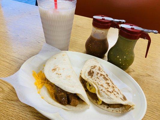 Horchata, carne guisada with cheese flour, bean and egg corn. Red and green salsa.