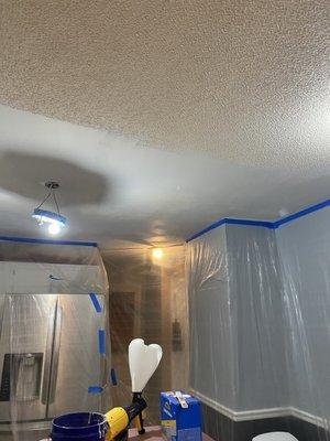 Sraped popcorn ceiling and patched areas of water damage