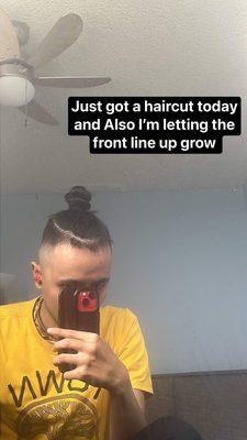 Man bun with a high fade