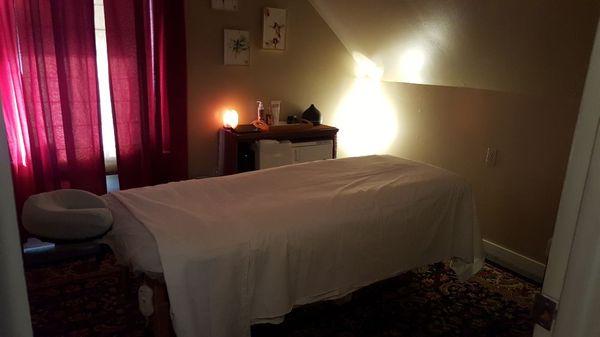 Room 2, typically Erin's. Has towel/ hot stone warmer. She uses a lot of heated rocks in her Integrative massage to relieve tight muscles.