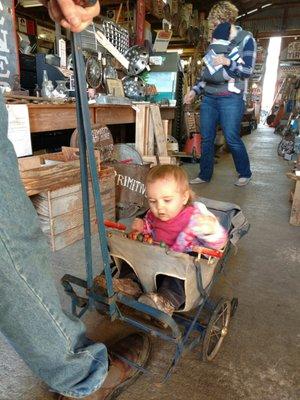 Riding in the antique stroller and counting beads