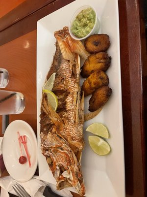 Fried Tilapia with plantains and a side of Guacamole Fresco con Chips