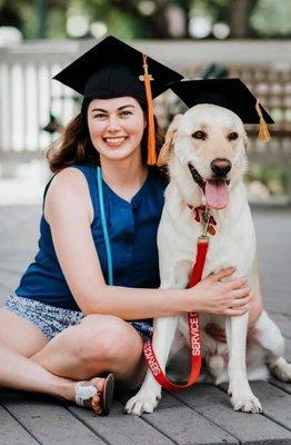 Training client Chelsea and her service dog, Donner, at her nursing school graduation.