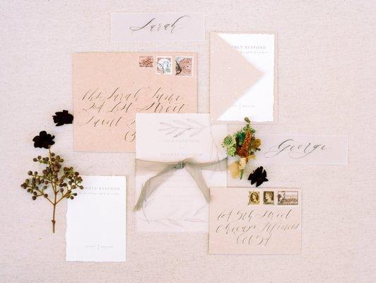 Invitation suite on handmade paper with calligraphy accents. Photo by Laura Ann Miller Photography