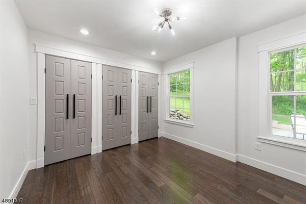 Bedroom with custom closet doors.