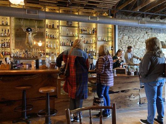 Coffee bar, customers and baristas.